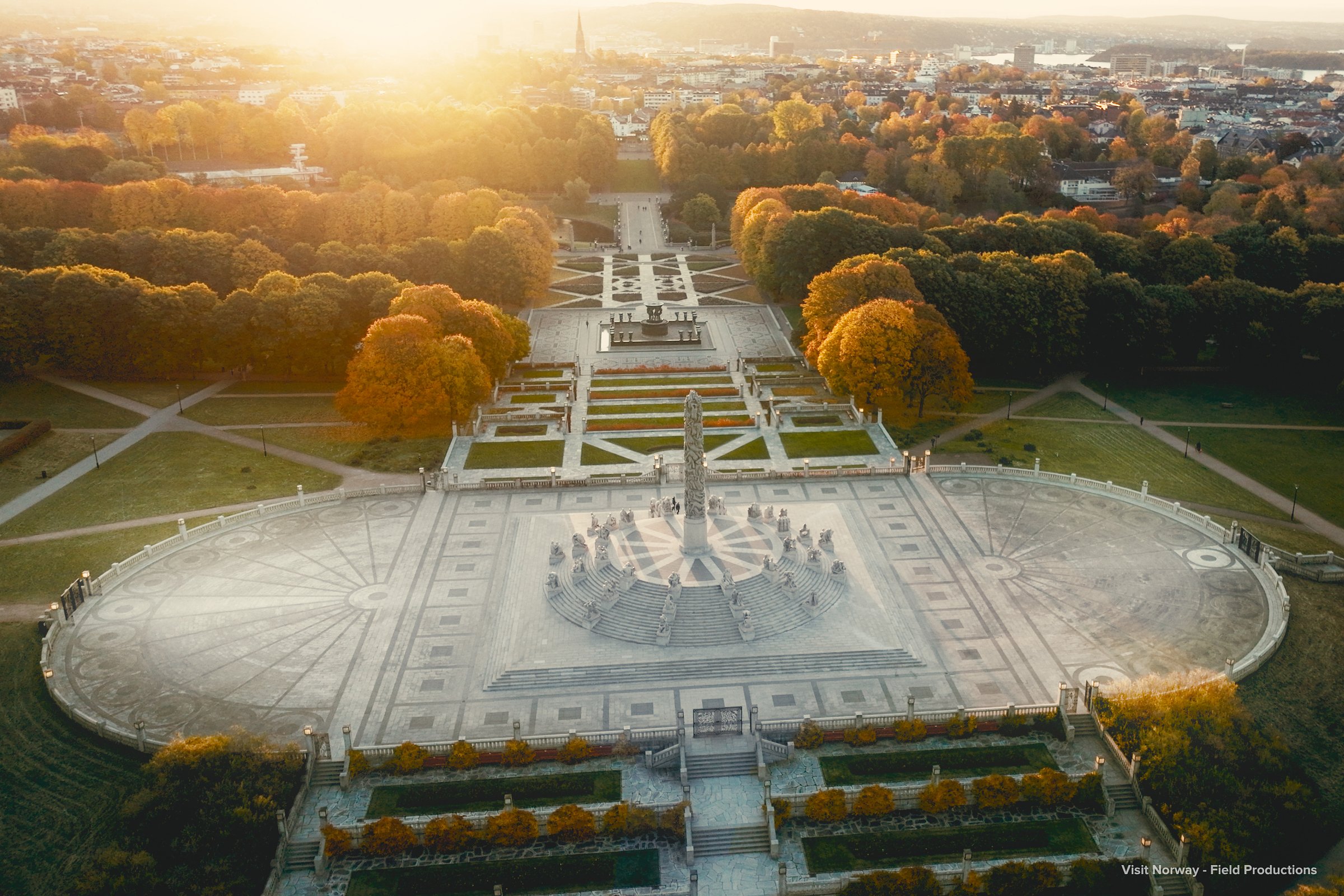 Overhead view of the Monolith and gardens in Oslo’s Frogner Park at sunset.